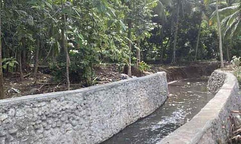 A photo showing a section of Soligao Creek after FDC Misamis finished 160 meters of riprapping and dredging, which helped reduce flooding in nearby areas.
