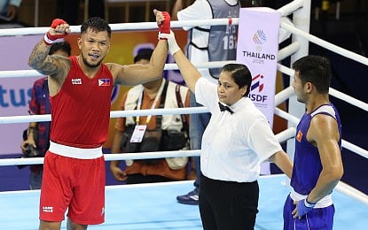 TRIUMPHANT. A referee raises the hand of Filipino boxer Eumir Marcial during the semifinal round in the 33rd Southeast Asian Games in Thailand on Friday (Dec. 19, 2025). Marcial beat Indonesian Maikhel Muskita, 4-1, to capture the gold in the men’s 80kg final at the Chulalongkorn University Sports Center (Photo courtesy of POC Media Pool)