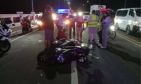 A woman died in a road accident along Davao City Coastal Road around 8:08 p.m. on Tuesday, December 30, 2025, after falling from a motorcycle and being run over by a Yutong bus. The incident occurred when the motorcycle she was riding brushed against a white van that fled the scene, causing the motorcycle to swerve.