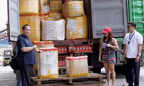 PORT INSPECTION. Bureau of Customs Commissioner Ariel Nepomuceno (left) leads the inspection and rollout of abandoned balikbayan boxes in Port Area, Manila on Dec. 18, 2025. The BOC has moved the deadline for the delivery of balikbayan boxes from Jan. 6 to Feb. 14, 2026. (PNA photo by Yancy Lim)