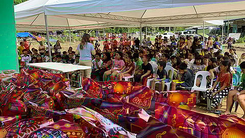 Tino-affected children in Lusaran receive gifts