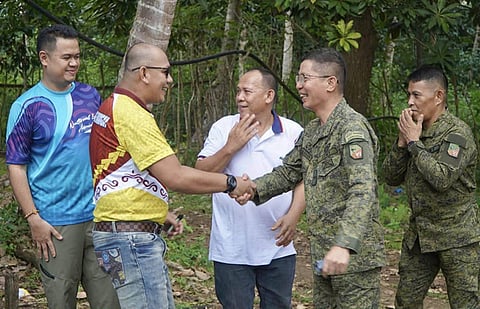 ZAMBOANGA. Alfaidar Akam, village chief of Timpook, Patikul, Sulu (2nd from left), warmly welcomes Engineer Robert Berni Rada II, head of the National Irrigation Administration-Zamboanga Peninsula (left), and Brigadier General Emmanuel Cabasan, 1103rd Infantry Brigade commander (2nd from right), who explored potential water sources in the village on Wednesday, January 14.
