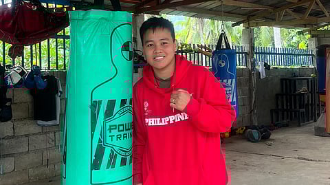NESTHY PETECIO AT TUBAN HOME. Two-time Olympic boxing medalist Nesthy Petecio poses beside a punching bag at her outdoor training area in Barangay Tuban, Sta. Cruz, Davao del Sur, on January 13, 2026. Petecio returned home after the 2025 Southeast Asian Games to rest, recover from eye surgery, and recharge.