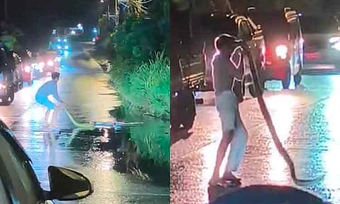 A man was seen swinging a large snake along Cabantian Road in Davao City on Monday evening, January 19, 2026.