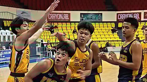 CEBU. John Cedric Sasil of the USPF Baby Panthers tries to escape a double-team defense by the USJ-R Jaguar Cubs during their Cesafi 15-under match on Thursday, January 29, 2026.  