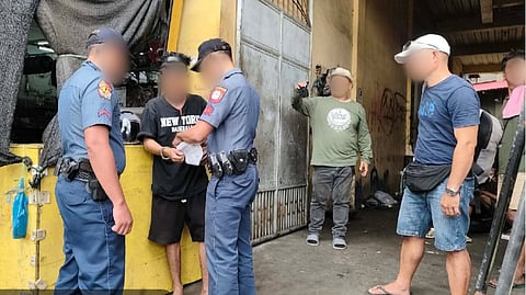 ILOILO. Police personnel of the Sapian Municipal Police Station and Roxas City Police Station escort the province’s 2nd most wanted suspect after his arrest for two counts of statutory rape in Barangay 8, Roxas City, Capiz, on January 28, 2026. 