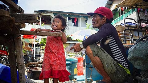 Kenneth Bayutas and daughter Niña in their life’s journey on their e-bike.  
/ CONTRIBUTED