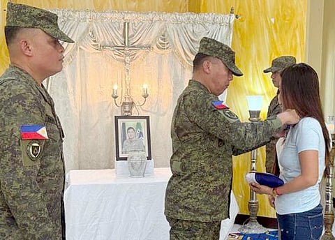 ZAMBOANGA. Major General Leonardo Peña, commander of the 11th Infantry Division and Joint Task Force Orion, formally presents the Philippine Flag and conferred the posthumous Bronze Cross Medal to Jenelyn, widow of Staff Sergeant Windel Sabuyas, Jr. of the 21st Infantry Battalion for risking his life to save others during the MV Trisha Kerstin 3 maritime tragedy on January 26. 