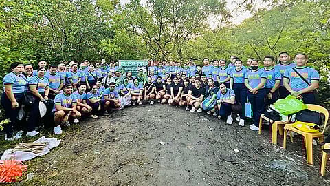 Iloilo City police lead mangrove planting, coastal clean-up