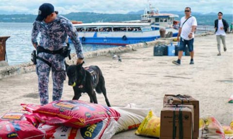 SAFETY INSPECTION. A Philippine Coast Guard K9 inspects passengers' baggage at Sta. Ana Wharf in Davao City in this December 2024 photo. The Philippine Coast Guard, Maritime Industry Authority and Bangsamoro MARINA on Thursday (March 5, 2026) made a joint reaffirmation to intensify enforcement of maritime laws and safety compliance to ensure that no ship can sail without the necessary documents or certificates. (PNA photo by Robinson Niñal Jr.)