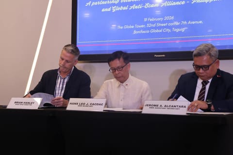 MANILA. From L-R: Gasa Apac Director Brian Hanley, DMW Secretary Hans Leo J. Cacdac, and DMW Assistant Secretary Jerome A. Alcantara sign the Memorandum of Understanding aimed at strengthening protection for overseas Filipino workers against online scams. 