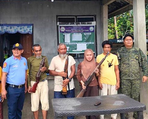 ZAMBOANGA. Residents from two villages in Siasi, Sulu, surrender high-powered firearms on Tuesday, March 10, following community engagement involving security forces and local government units. 