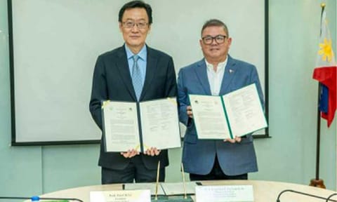PARTNERSHIP. Agriculture Secretary Francisco Tiu Laurel Jr. (right) and professor Pai-Chi Li, head of the Asian Institute of Technology (AIT), hold the signed memorandum of understanding (MOU) at the AIT's Bangkok campus in Thailand on March 11, 2026. Tiu Laurel on Friday (March 13) said the five-year strategic partnership is designed to accelerate agricultural innovation, develop human capital, and strengthen food security in the Philippines. (Photo courtesy of DA)