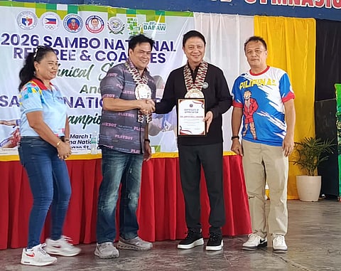 APPRECIATION. Dabawenyo Pilipinas Sambo Federation Inc. president Paolo Tancontian, second from left, presents a plaque of appreciation to Philippine Sports Commission (PSC) chairman John Patrick Gregorio during the opening of the 2026 National Sambo Referee and Coaches Technical Seminar and Sambo National Open  Championships, at Sta. Ana National High School covered court.