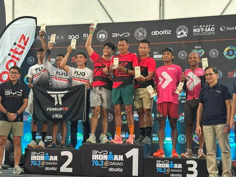 IRONMAN 70.3 RELAY KINGS.  Team Juna celebrates on the podium after winning the relay championship at the BYD Ironman 70.3 Davao in Davao City on March 22, 2026.