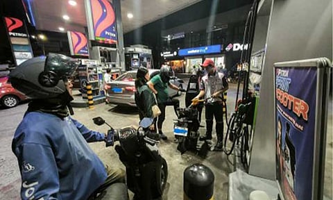 PRICES UP. Motorists queue up at a fuel station in Quezon City Monday night (March 23, 2026) ahead of the scheduled increase of fuel products Tuesday (March 24). Energy Secretary Sharon Garin said domestic fuel supply remains adequate until mid-May, and assured the public that the government is already in talks with its counterparts in countries that produce oil products, to also help in ensuring domestic supply. (PNA photo by Joan Bondoc)