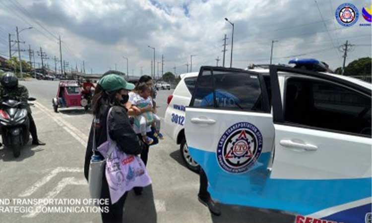 FREE RIDE. Passengers board a patrol vehicle of the Land Transportation Office (LTO) for a free ride along designated routes in Quezon City on Thursday (March 26, 2026). Government agencies, including the Philippine National Police (PNP), deployed vehicles to assist commuters affected by a two-day transport strike staged by transport groups amid continued fuel price increases. (Photo courtesy of LTO)