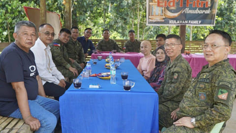 ZAMBOANGA. Brigadier General Emmanuel Cabasan, 1103rd Infantry Brigade commander (2nd from right), and his deputy, Colonel Abdelhalim Sakilan (right), hold a peace and security consultation in Bud Taran village, Indanan, Sulu to deepen peacebuilding efforts and reinforce community security. 
