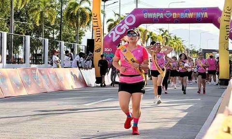 Women participants set off at the starting line of the Gwapa Dabawenya Run in Davao City, marking the beginning of a race that celebrates strength, wellness, and community during the IRONMAN 70.3 weekend.