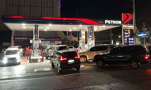 Long lines of vehicles were seen at a gasoline station in Davao City on late Monday night, April 6, 2026 as people rushed to refuel ahead of an expected fuel price increase.