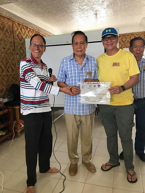 ILOILO. Environmental advocate Atty. Antonio Oposa gives Iloilo Governor Arthur Defensor Sr. and Provincial Administrator Raul Banias the Certificate of the Highest Recognition given by the United Nations Environmental Programme and the Institute of Governance and Sustainable Development (IGSD) based in Washington DC for the province's commitment to protect and preserve the Visayan Sea during an Earth Day celebration in Bantayan Island, Cebu on Sunday, April 22, 2018. At right is Negros Occidental Governor Alfredo Marañon. (Contributed Photo)