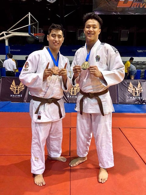DABAWENYO CHAMPION. Chino Tancontian of the University of Sto. Tomas, right, holds his gold medal at the close of the annual Hajime International Invitational Judo Tournament held at the Ateneo de Manila University Blue Eagles Gym in Quezon City over the weekend. (Contributed photo)