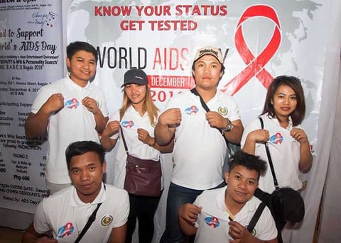 BAGUIO. HIV-Aids advocates show their shirts with the symbolic ribbon to advocate awareness of the disease. More than 9.4 million people do not know that they are living with Aids. (Photo by Jean Nicole Cortes)