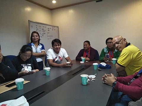 PAMPANGA. FEACO Pollution Control Officer Mercy Simon (standing) assures fisherfolk and officials of BFAR, EMB and local governments of Macabebe and Masantol that the alcohol fermentation firm did not discharge toxic waste into the Pampanga River. (Contributed photo)
