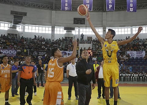 TACLOBAN CITY. Former Leyte First District Rep. Ferdinand Martin Romualdez leads the ceremonial toss during the opening games of Eastern Visayas Collegiate Athletic Association (EVCAA) basketball tournament at the Astrodome in Tacloban City. (Contributed photo)