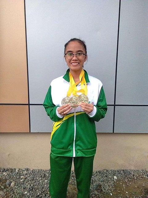 DAVAO. Davao City woodpusher Irish Yngayo shows her three golds medals won in the Davraa Meet 2019 chess competition that closed at Philippine Nikkei Jin Kai International School Wednesday, January 30. (Contributed Photo)