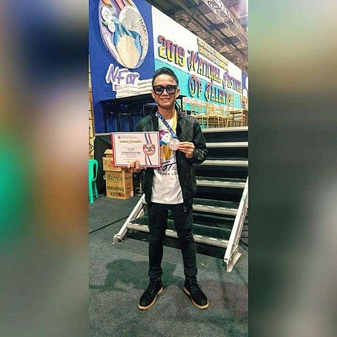 DAGUPAN CITY. Gorg Ryan Requiez brings honor to Eastern Visayas region after he bagged the first place in "Dagliang Talumpati" in the 2019 National Festival of Talents (NFOT) held in Dagupan City. A senior high school student from San Joaquin National High School in Palo, Leyte, Requiez dedicated his award to his parents who died along with his relatives and friends during the 2013 Super Typhoon Yolanda (Photo courtesy of Gorg Ryan Requiez)