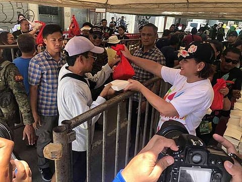 Davao City Mayor Sara Duterte-Carpio personally distributed roasted cow (lechon baka) during lunch at Claro M. Recto (Claveria), Davao City. Around 50 roasted cows were served to the public as part of the 82nd Araw ng Dabaw celebration on Saturday, March 16, 2019.