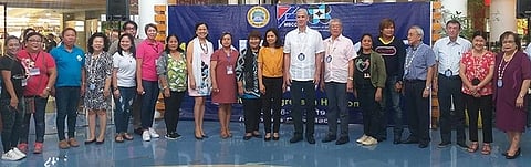 BACOLOD. PCCI-Western Visayas governor Donna Rose Ratilla (right) with Governor Eugenio Jose Lacson (eight from right), MBCCI officials headed by president Roberto Montelibano (seventh from right) and chief executive officer Frank Carbon (fourth from right), provincial supervising tourism operations officer Cristine Mansinares (ninth from right) and tourism officers in the province during the opening of the 11th Negros Business Week at Robinsons Place Bacolod running from July 6 to 17 this year. (Erwin P. Nicavera)