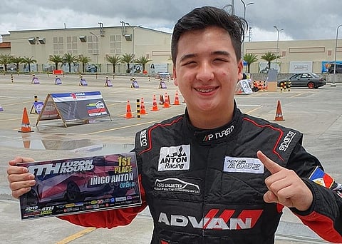 CAVITE. Iñigo Anton flashes the number one sign after clinching the Philippine Autocross Championship Series (Pacs) Open Class championship last Sunday held at Acienda Outlet Mall, Silang Cavite. Contributed photo