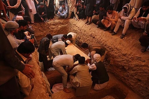 KABUL, AFGHANISTAN. Afghans bury the bodies of victims of the Dubai City wedding hall bombing during a mass funeral in Kabul, Afghanistan, Sunday, August 18, 2019. The deadly bombing at the wedding in Afghanistan's capital late Saturday that killed dozens of people was a stark reminder that the war-weary country faces daily threats not only from the long-established Taliban but also from a brutal local affiliate of the Islamic State group, which claimed responsibility for the attack. (AP)