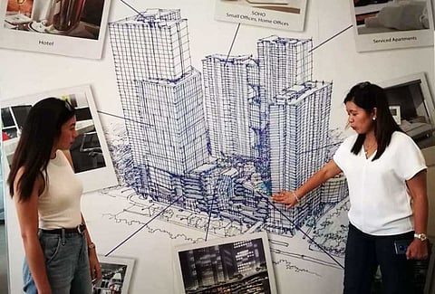 INTEGRA-TED DEVE-LOPMENT. Rona Lacanlale (left), assistant business development manager of Taft Properties, and Myra Lynn Gilig, vice president and deputy chief operating officer of Taft Properties, show off the micro-township design of Taft East Gate. (SUNSTAR FOTO  / ALLAN CUIZON)