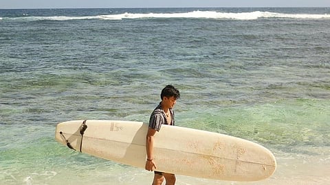SIARGAO. Riding the waves of Siargao (Photo by Ace June Rell S. Perez)
