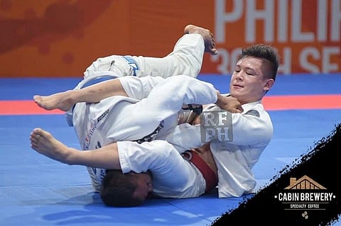 SILVER FINISH. Marc Alexander Lim of Davao City, top, wins a silver medal for Team Philippines in the recently-concluded 30th Southeast Asian (SEA) Games men's jiu jitsu competition at the Laus Group Events Center in San Fernando, Pampanga. (Real Fight Philippines)