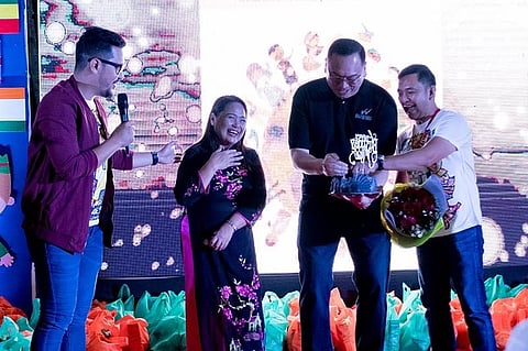 HAPPY BIRTHDAY. Waterfront Insular Hotel manager Bryan Yves Lasala present a cake to birthday celebrant Doc Mae shown here with emcee Rovic Cuasito and House of Hope officer Frederick Rubinos. (Photo by Karlo Flores)