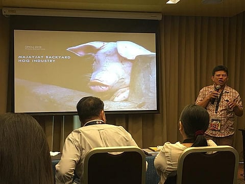 MANILA. PCIJ fellow and photojournalist Bernard Testa shares his journey in documenting the environmental impact of the backyard hog industry in Majayjay, a town in Laguna. (Photo by Roberto A. Gumba Jr.)