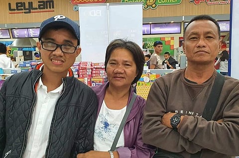 BACOLOD. Carl Malone Montecido with his parents Ferdinand and Divina. (Photo by Carla N. Cañet)