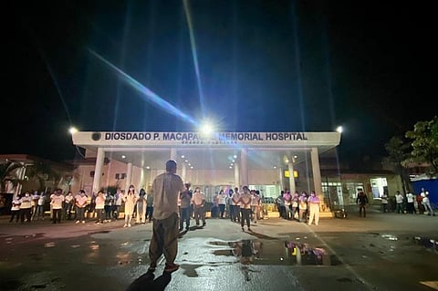 PAMPANGA. Some 200 healthcare workers from Diosdado P. Macapagal Memorial Hospital gathered at the center of the hospital to offer their own fight dance as a gallant gesture to pay tribute and salute to their fellow frontliners during the nationwide "We Light As One" celebration in the country. (Contributed photo)