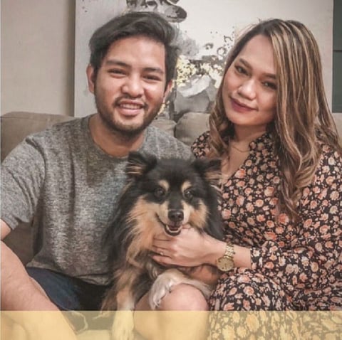 Karhlo Go and Gabe Llanto on their dog Magnus