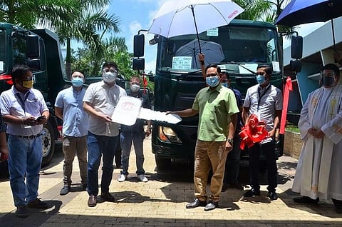 ILOILO. Governor Arthur Defensor Jr. leads the blessing of 10 brand new dump trucks on September 3, 2020. The blessing was officiated by Fr. Gremar Lacson. (Iloilo Capitol PIO)