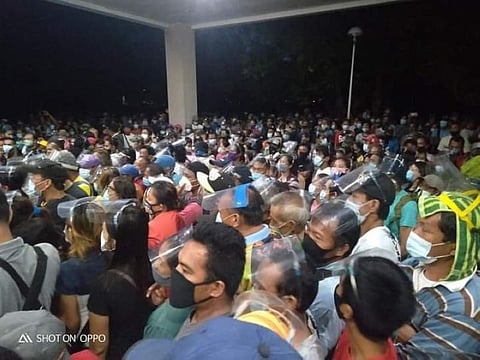 People crowd the New Government Center in Bacolod City on Saturday, disregarding the health and safety protocols set amid the implementation of modified enhanced community quarantine in the city. (Rica Garibay)