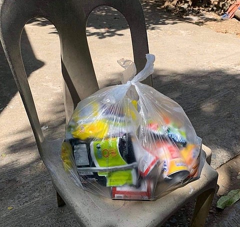 BULACAN. The local government unit of Cacarong, Pandi, Bulacan distributed on Tuesday, March 30, 2021, a bag of groceries consisting of three kilograms of rice, four packs of noodles, four cans of meat loaf, two cans of corned beef and mongo beans. (Contributed)