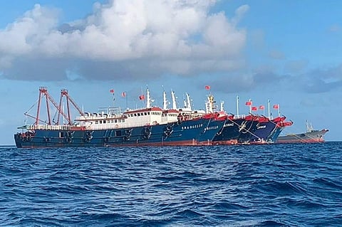 CHINA. In this photo provided by the National Task Force-West Philippine Sea, Chinese vessels are moored at Whitsun Reef, South China Sea on March 27, 2021. (AP)