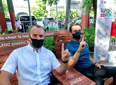 Partners in achieving a world without waste in Manila: CCBPI president and CEO Gareth McGeown and Manila City Mayor Isko Moreno sit comfortably on a bench made from over 3,000 pieces of transformed PET plastic bottles. The bench was manufactured by Winder Envirotech, a Davao-based recycling company.