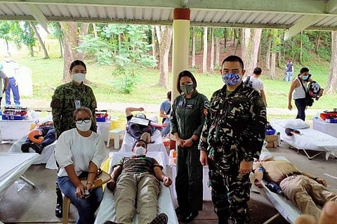 BLOODLETTING. Reserve officers and personnel of the Philippine Air Force pose during a bloodletting activity in Clark Freeport. (Contributed photo)