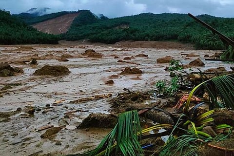 LEYTE. This photo provided by the Philippine Coast Guard shows a landslide area in Baybay City, Leyte province on April 11, 2022. President Rodrigo Duterte says industrialized countries should pay the countries affected by climate change, including the Philippines.